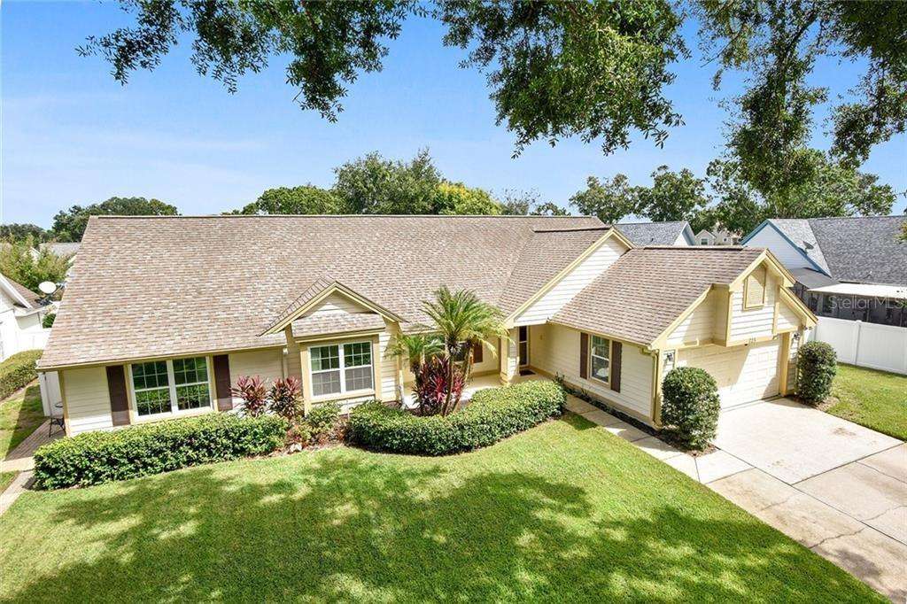 A beautiful photo of a home with a brand-new roof installed by Storm-Proof Your Roof, showcasing the company's commitment to delivering durable and visually appealing roofing solutions that protect your home from the elements.