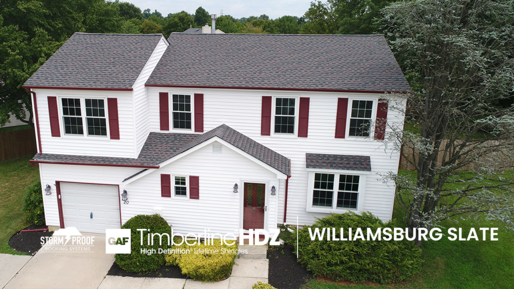 A residential home with a roof made of GAF Williamsburg Slate Shingles.