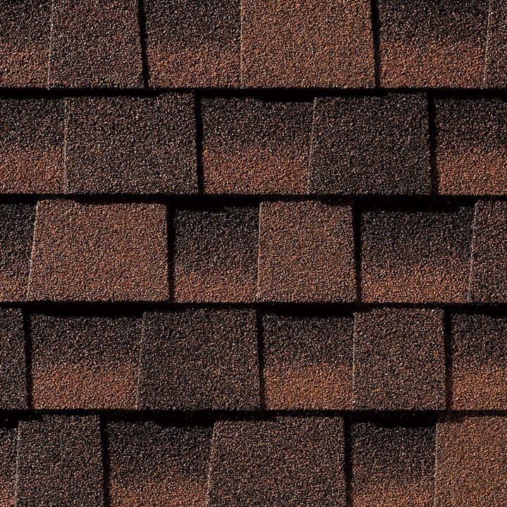 Timberline HD Hickory shingle swatch from GAF, a top roofing manufacturer, featuring warm, earthy tones and a unique texture that provides a natural and rustic look.