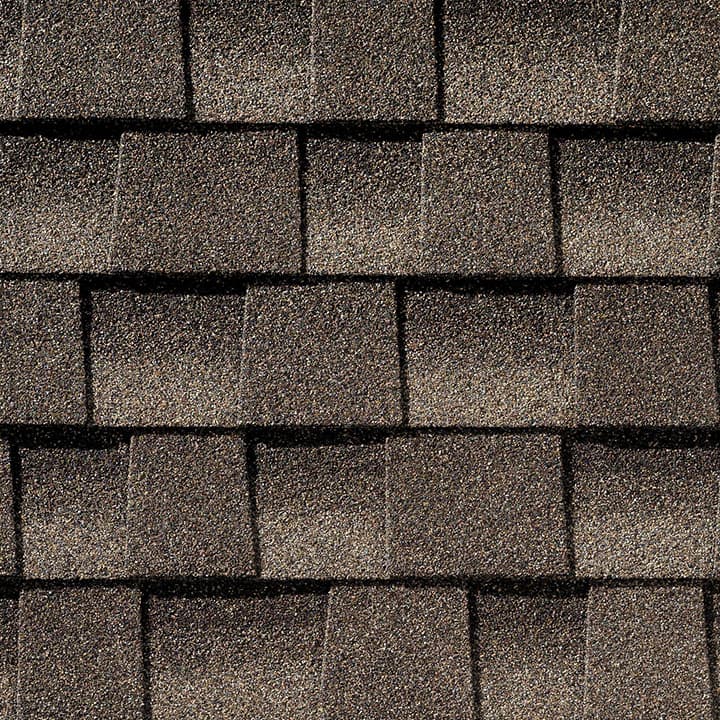Timberline HD Mission Brown shingle swatch from GAF, a top roofing manufacturer, featuring deep, earthy tones and a distinctive texture that adds warmth and richness to any home.