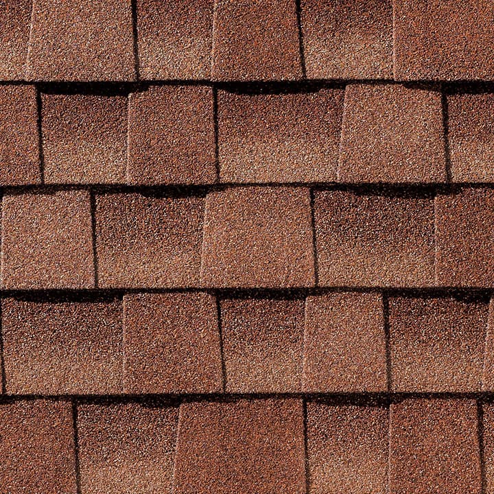 Timberline HD Sunset Brick shingle swatch from GAF, a top roofing manufacturer, featuring warm, earthy tones and a distinctive texture that adds character and durability to any home.