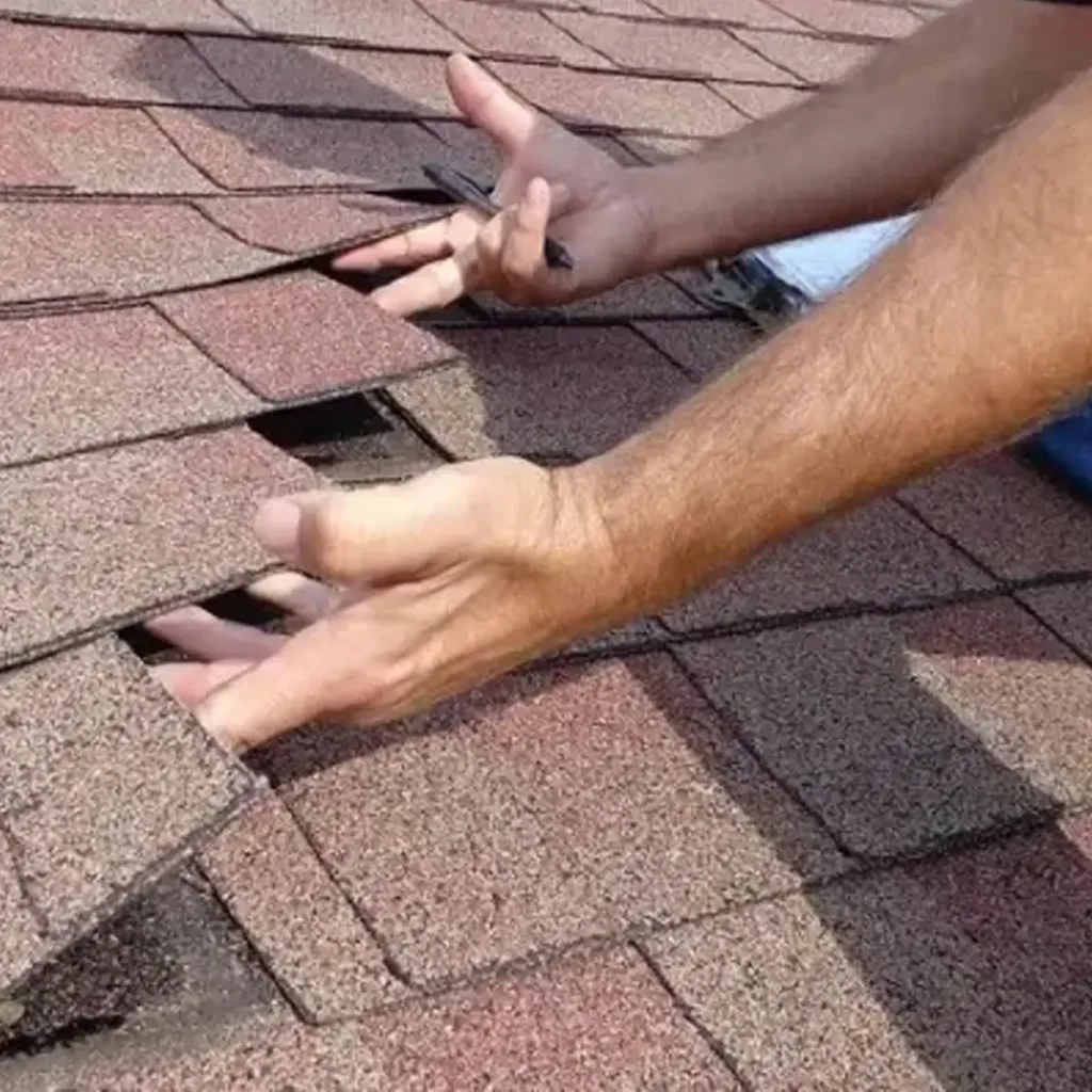 Roof inspection and assessment by Storm Proof Roofing Systems showing a professional inspecting a roof.