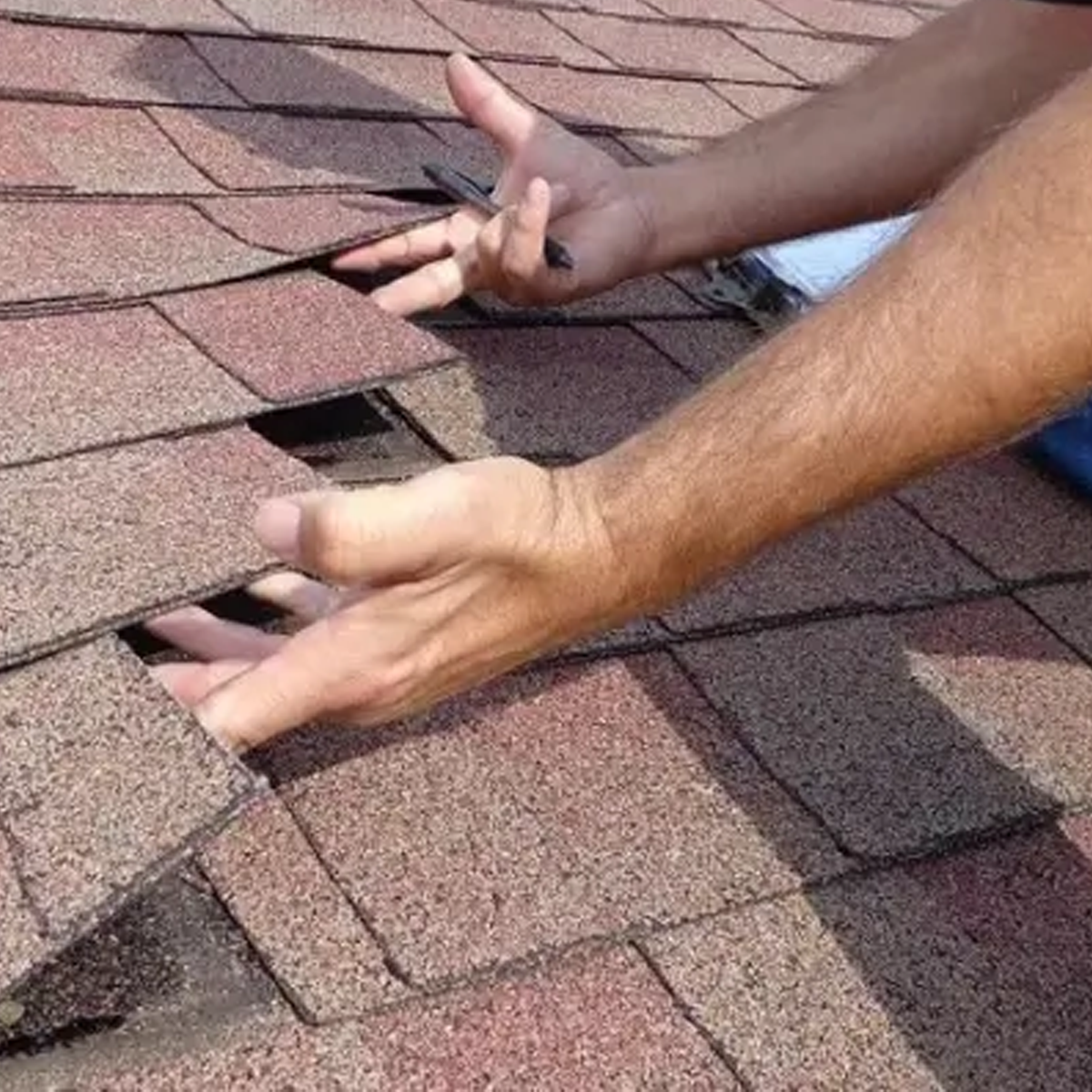 Roof inspector assessing the condition of a residential roof