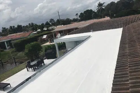 Residential roof waterproofing application in progress.