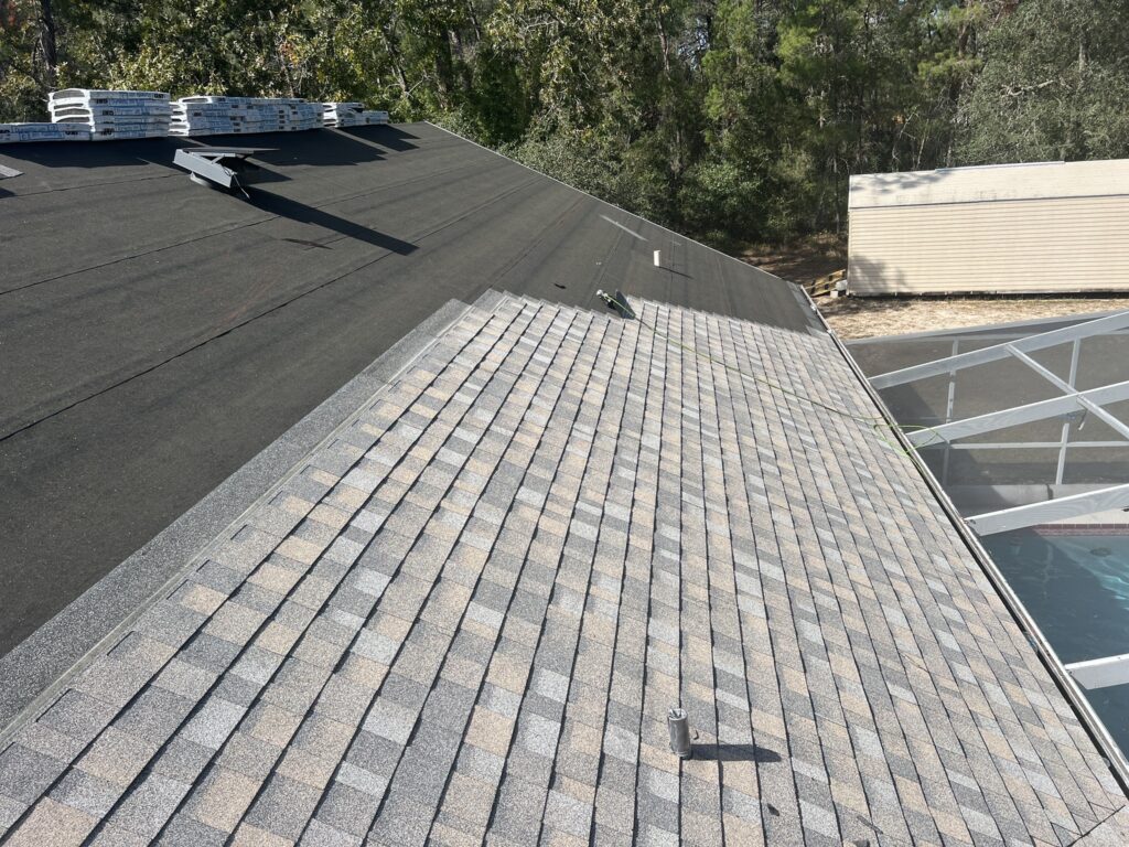 A close-up of shingles being repaired on a residential roof in Citrus County.